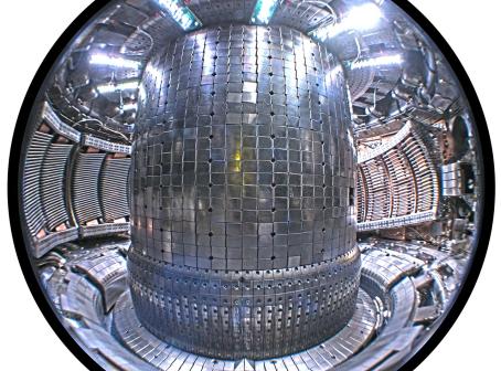 Interior of the Alcator C-Mod tokamak at the MIT Plasma Science and Fusion Center. Two Ion Cyclotron Range of Frequencies (ICRF) antennas are visible to the left of the central column. A new magnetic field-aligned ICRF antenna is visible to the right of the central column. (Source: Mike Garrett, Wikipedia.org)