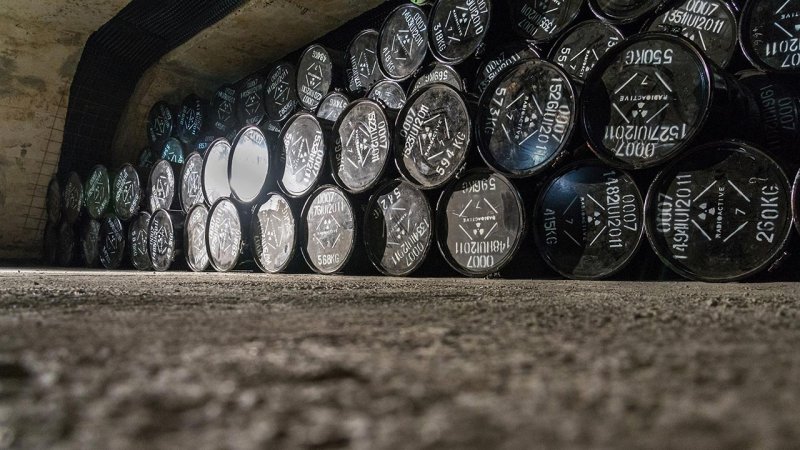 Low- and intermediate-level radioactive waste is commonly packaged in steel drums and stored in engineered near-surface or underground disposal facilities designed to provide long-term isolation from the environment. (Source: © josefkubes / stock.adobe.com)