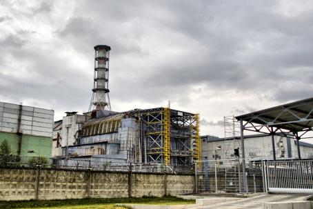 The huge concrete sarcophagus of block 4 was constructed a few months after the accident in order to prevent any additional release of radioactive substances into the atmosphere. This sarcophagus is already near its service-life end and its replacement is being designed. (Source: © Nomad_Soul / stock.adobe.com)