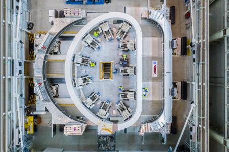 A toroidal coil is inserted into a structural steel case. (Credit © ITER Organization, http://www.iter.org/)