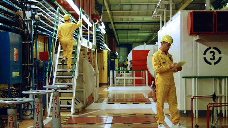 Security rounds of the equipment and work inside the secured zone. The standard employee’s protective equipment also includes a film dosimeter.