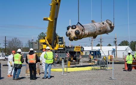 Facilitating future decommissioning may also include the gradual removal of large components already during preparatory activities. The image shows the handling of part of the reactor equipment of the Heavy Water Components Test Reactor during dismantling activities. (Source: Wikipedia.org)