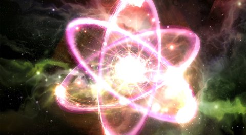 What force attracts electrons to the nucleus of an atom?