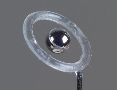 Saturn target developed at the Laboratory for Laser Energetics for polar-direct-drive experiments on OMEGA, with the capsule suspended by fine spider-silk fibres. (Source: Wikipedia.org) Saturn target developed at the Laboratory for Laser Energetics for polar-direct-drive experiments on OMEGA, with the capsule suspended by fine spider-silk fibres. (Source: Wikipedia.org)