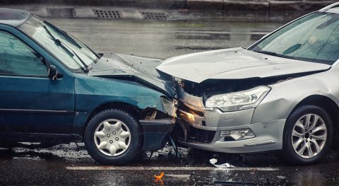 How is it that in a car accident, the speed of the cars do not add up and what is the resulting crash speed?