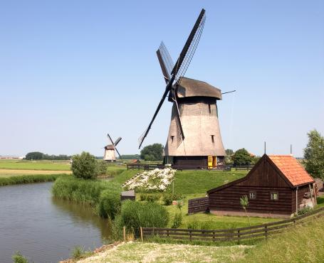 A windmill near the town of Alkmaar, The Netherlands, known for its cheese fairs. (Source: © Phillip Minnis / stock.adobe.com)