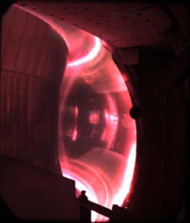 Red glow of hydrogen plasma inside EAST tokamak. Hydrogen atoms lose energy by emitting at a wavelength of 656 nm, which corresponds to red light. (Source: Wikipedia.org)