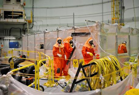 Decontamination represents an important part of nuclear facility decommissioning. The image shows workers preparing decontamination of a heat exchanger at the Experimental Breeder Reactor-II site. (Source: Wikipedia.org) Decontamination represents an important part of nuclear facility decommissioning. The image shows workers preparing decontamination of a heat exchanger at the Experimental Breeder Reactor-II site. (Source: Wikipedia.org)