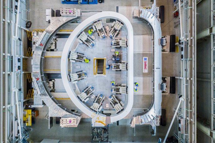 A toroidal coil of tokamak ITER is inserted into a structural steel case. (Credit © ITER Organization, http://www.iter.org/)